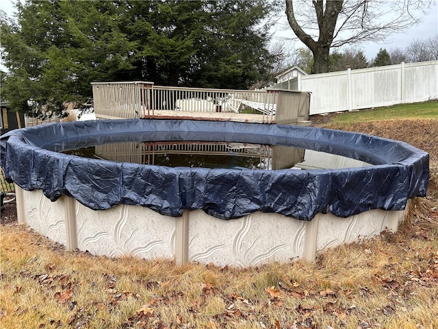 view of pool with a wooden deck