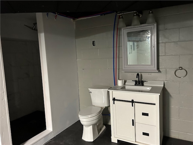 bathroom featuring a shower, vanity, toilet, and concrete floors