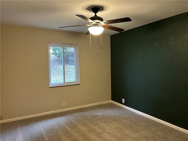 empty room with carpet floors and ceiling fan