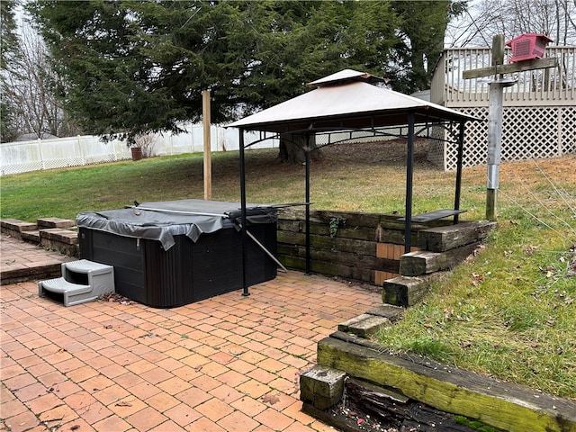 view of patio / terrace with a gazebo and a hot tub