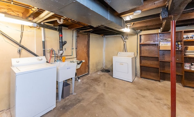 basement with washer and clothes dryer