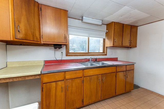 kitchen featuring sink and light tile patterned floors