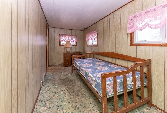 bedroom with wood walls