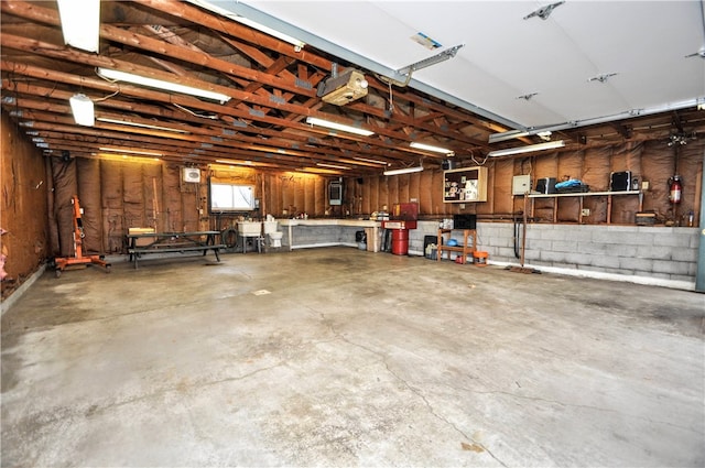 garage with a workshop area and a garage door opener