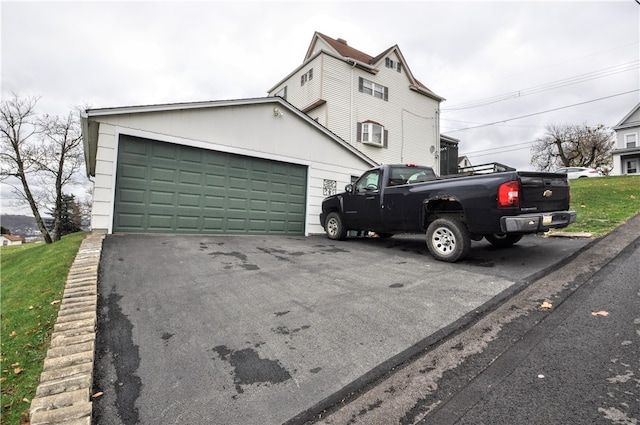 view of side of home with a garage