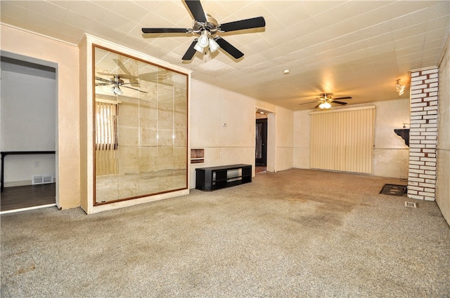 unfurnished living room featuring carpet