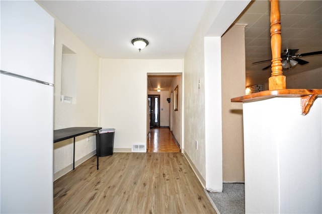 corridor with wood-type flooring