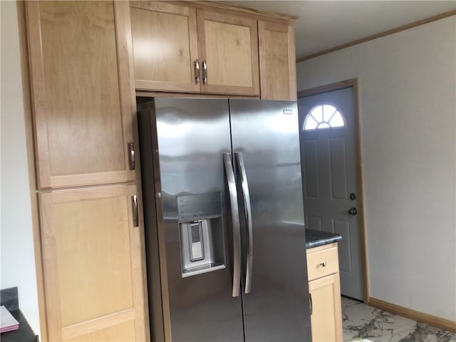 kitchen featuring crown molding, light brown cabinets, and stainless steel refrigerator with ice dispenser