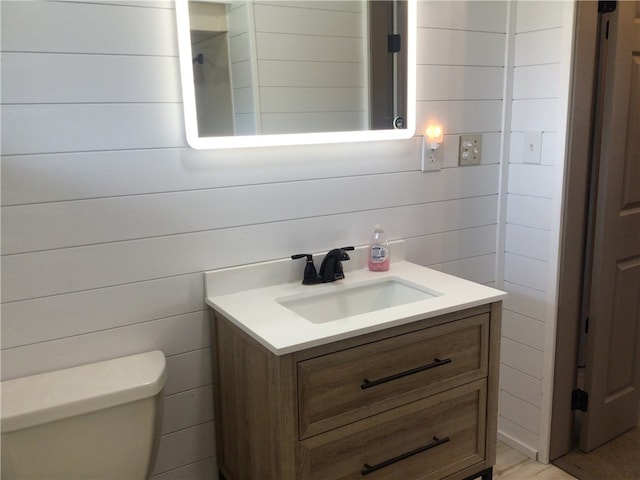 bathroom with vanity and toilet