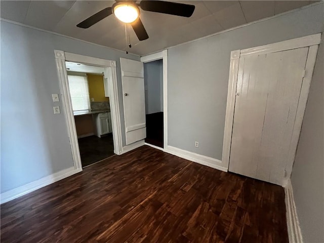 431 Euclid Ave, Glassport, PA 15045 - unfurnished bedroom with dark wood-style flooring, baseboards, and a ceiling fan