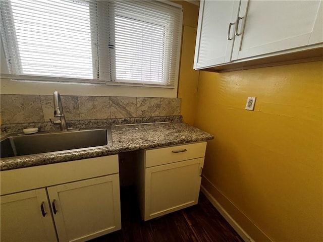 431 Euclid Ave, Glassport, PA 15045 - kitchen featuring a sink, dark wood-type flooring, baseboards, dark countertops, and white cabinetry