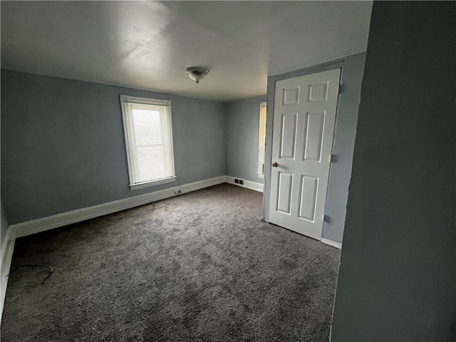 431 Euclid Ave, Glassport, PA 15045 - unfurnished bedroom with dark carpet and baseboards