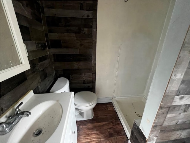 431 Euclid Ave, Glassport, PA 15045 - bathroom featuring toilet, a shower stall, vanity, and wood finished floors