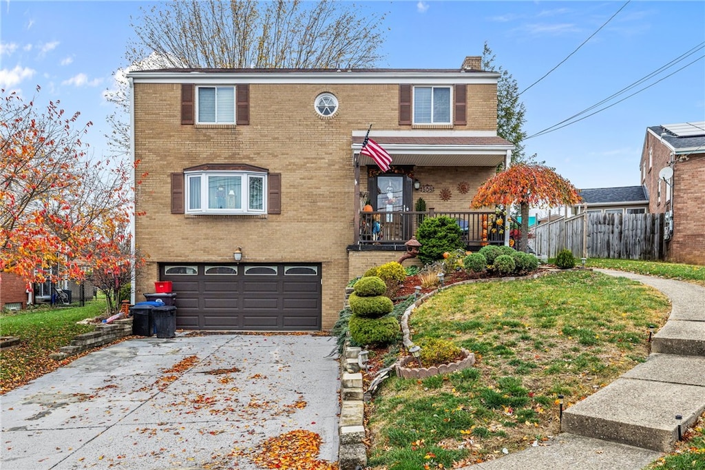 view of front of home featuring a front yard and a garage