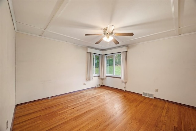 spare room featuring ceiling fan and hardwood / wood-style floors