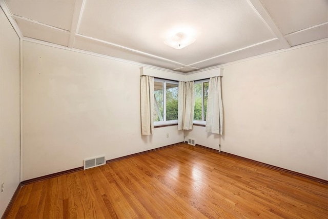 empty room with hardwood / wood-style flooring