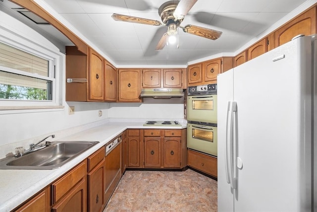 kitchen featuring white appliances, ceiling fan, and sink