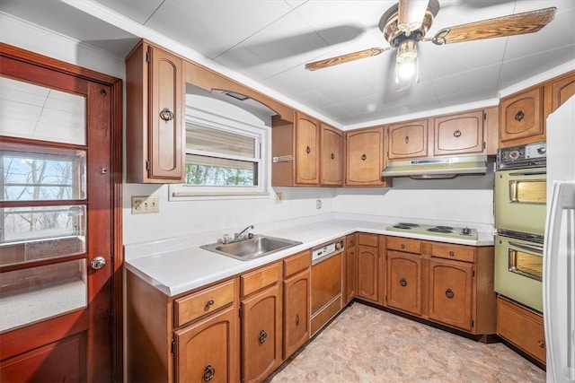 kitchen featuring ceiling fan, a healthy amount of sunlight, white appliances, and sink