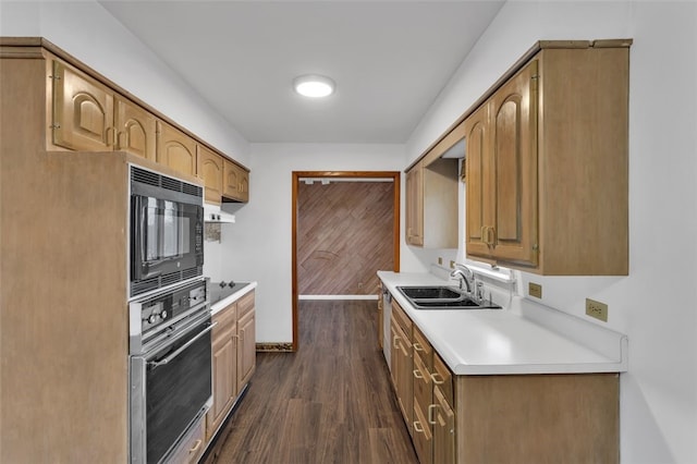 kitchen with black appliances, dark hardwood / wood-style flooring, and sink