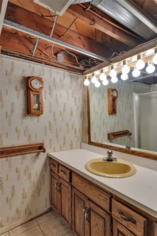 bathroom featuring tile patterned floors and vanity