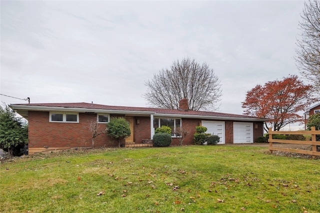 single story home with a garage and a front lawn