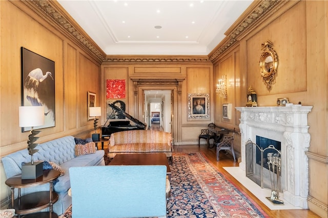 living area featuring light hardwood / wood-style floors and crown molding