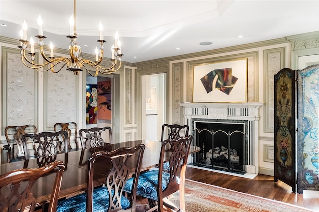 dining area with crown molding, dark wood-type flooring, and a notable chandelier