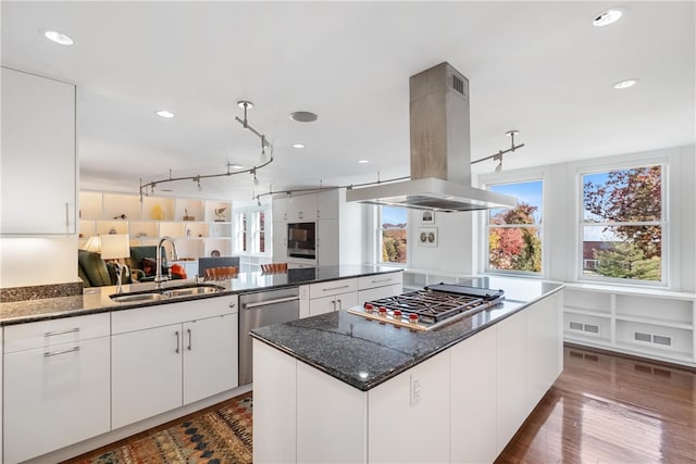 kitchen with white cabinetry, island range hood, sink, and stainless steel appliances