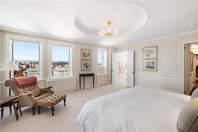 bedroom with light carpet, a tray ceiling, an inviting chandelier, and crown molding