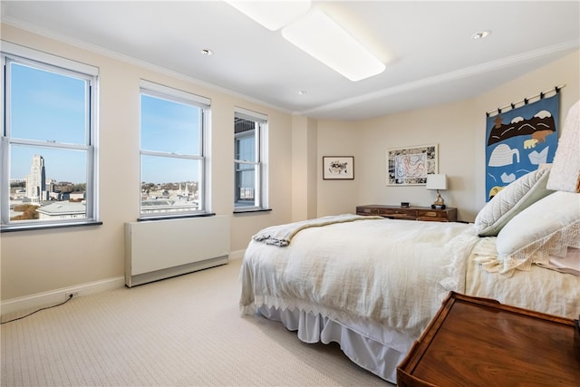 bedroom with light colored carpet and ornamental molding