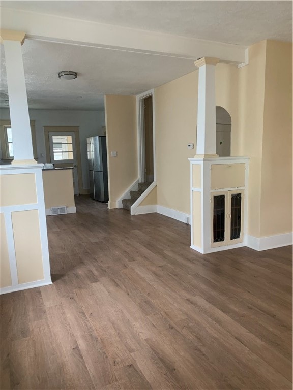 unfurnished living room with hardwood / wood-style flooring