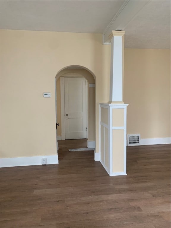 empty room featuring dark hardwood / wood-style flooring