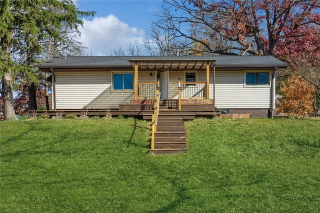 back of house with a lawn, a pergola, and a deck