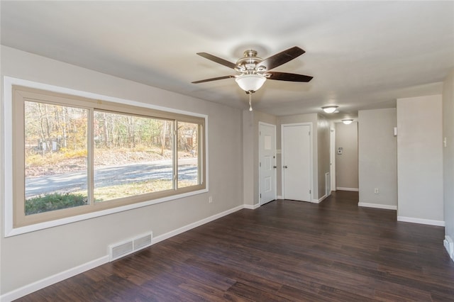 unfurnished room featuring dark hardwood / wood-style flooring and ceiling fan