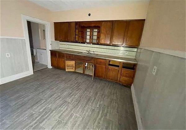 kitchen with dark wood-type flooring and sink