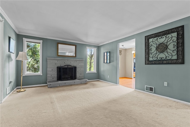 unfurnished living room with a stone fireplace, crown molding, and light colored carpet