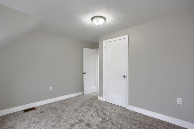 bonus room with carpet and lofted ceiling