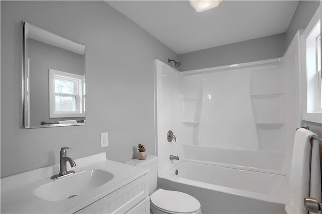 full bathroom with shower / bathing tub combination, vanity, and toilet