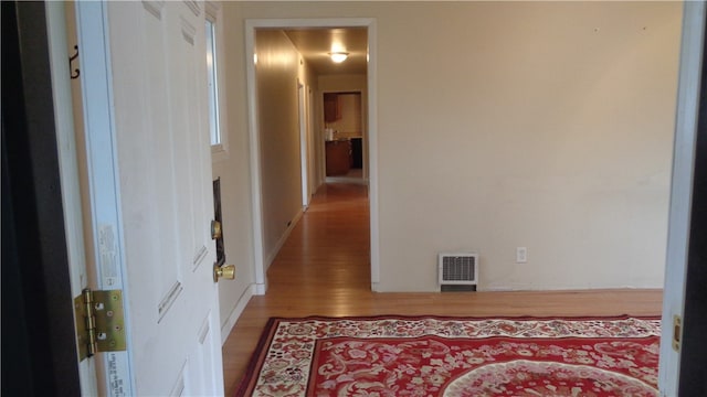 hall featuring hardwood / wood-style floors