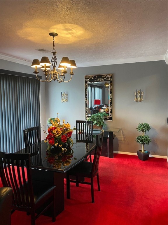 carpeted dining room with crown molding, a chandelier, and a textured ceiling