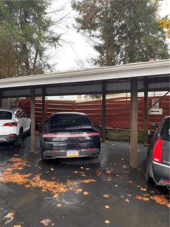 view of vehicle parking with a carport