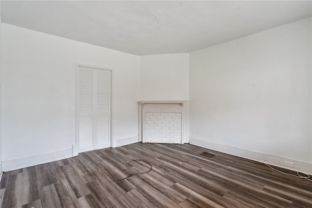 unfurnished room featuring dark hardwood / wood-style flooring