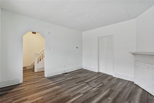 unfurnished room featuring dark hardwood / wood-style flooring