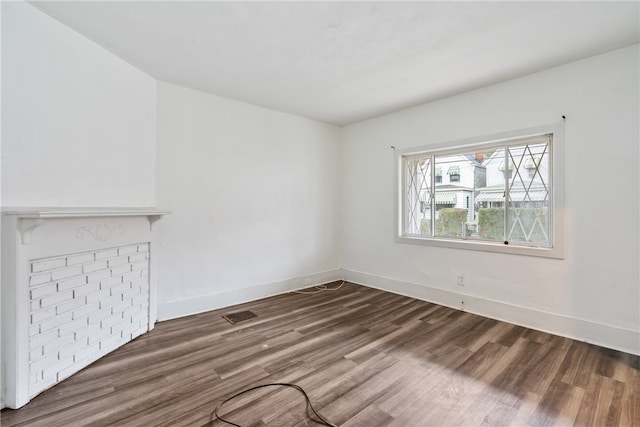 unfurnished living room featuring wood-type flooring