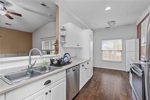 kitchen featuring dark wood-type flooring, sink, white cabinets, and stainless steel appliances