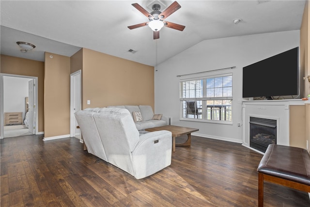 living room with dark hardwood / wood-style flooring, ceiling fan, and lofted ceiling