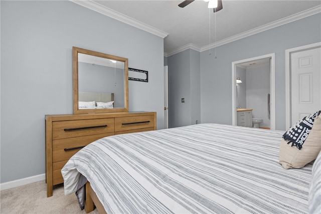 bedroom with ensuite bathroom, ceiling fan, light colored carpet, and crown molding