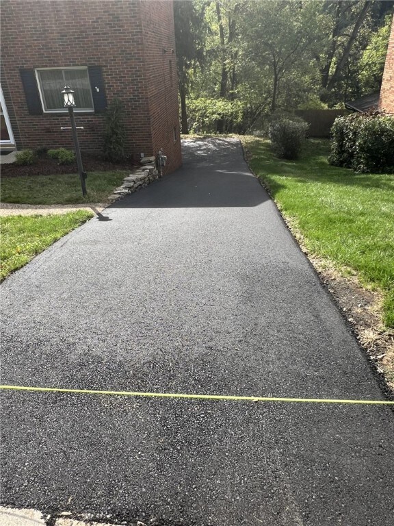 221 Sharon Dr, Forest Hills Boro, PA 15221 - view of home's exterior with brick siding and a yard