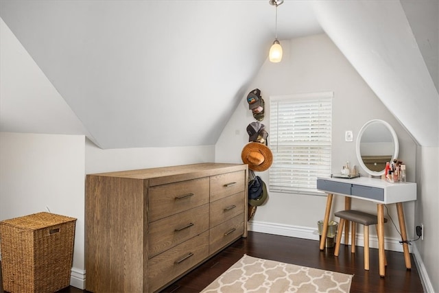 interior space featuring dark hardwood / wood-style flooring and lofted ceiling