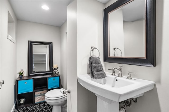 bathroom with sink and toilet